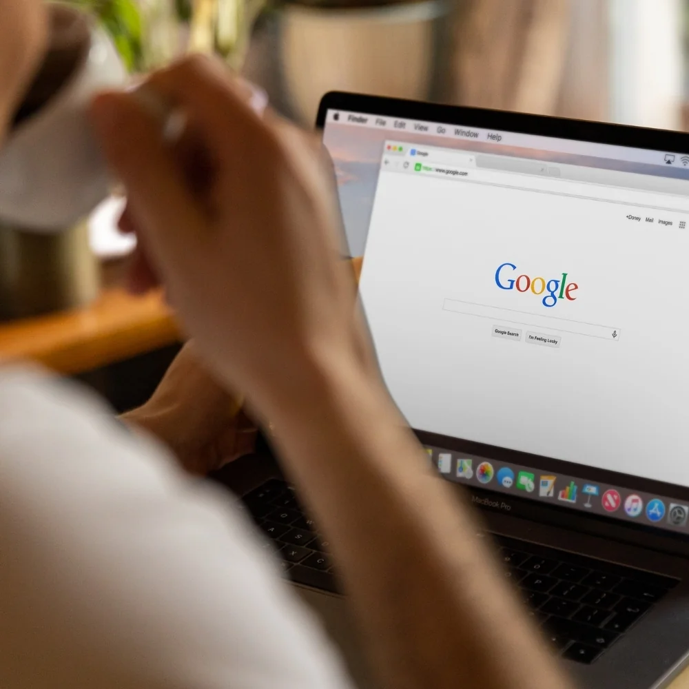 Person using a laptop with a search page open for Greenwich SEO work