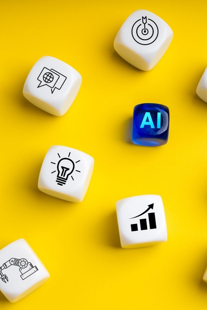 Yellow backdrop with dice bearing AI, search and graph symbols