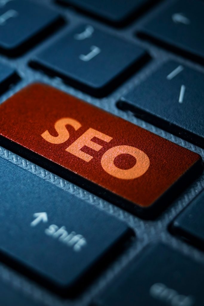 An orange SEO key set among keyboard keys